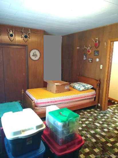 Everything in upstairs right bedroom including complete twin bed, several white tail antler mounts,