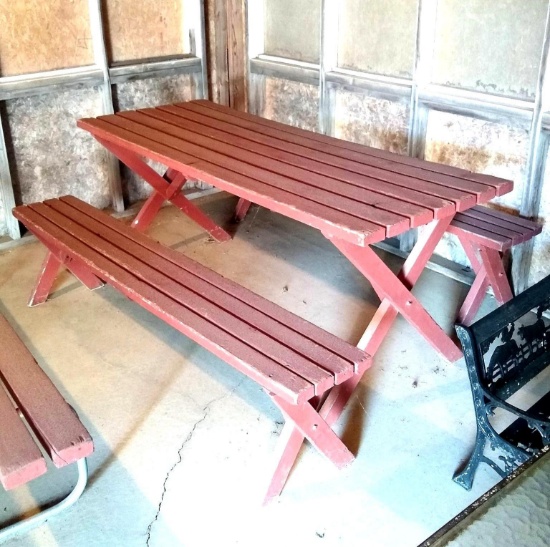 Wooden picnic table with two detached benches. Table is approx. 6' long.
