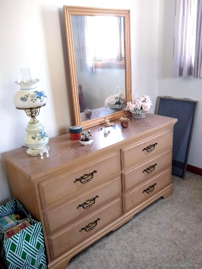 Everything in small main floor bedroom including hardwood dresser with dovetailed drawers and