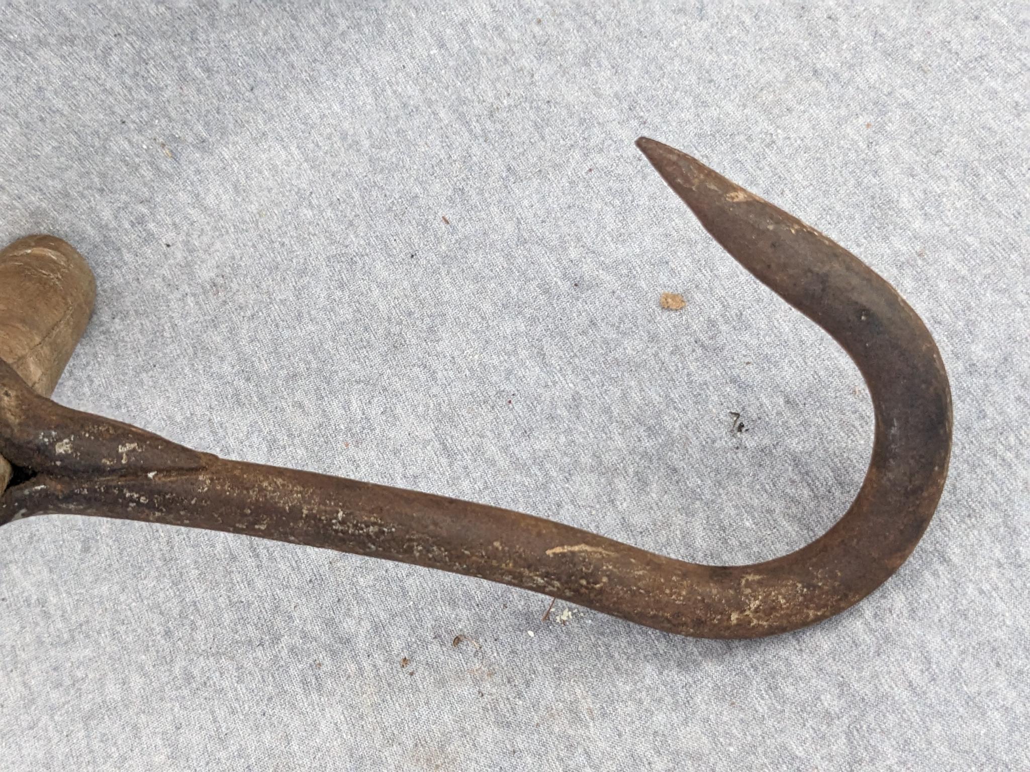 Hand-forged hay hook on 11 wooden handle. Would