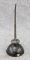 Tiny oil can may have held oil for a sewing machine or for other household appliances. Measures