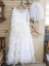 Custom lace tulle layered wedding dress and veil. Dress has some beaded embellishments on the top