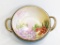 A beautiful Nippon two-handle bowl w/ a beautiful floral print on the inside. Measures 9