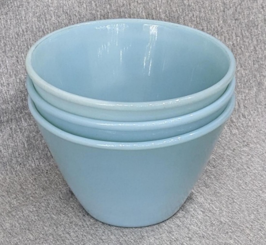 Three Fire King Oven Ware delphite blue mixing bowls are 6-1/2" x 4" tall. In good condition.