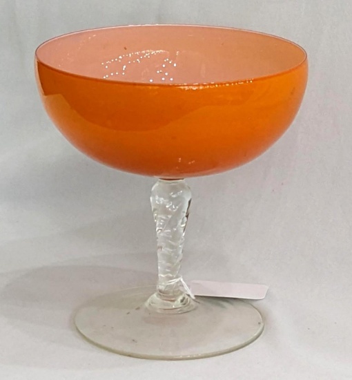 Nice bright orange stemmed bowl, looks to be hand blown with applied base; measures 7" x 8" tall.