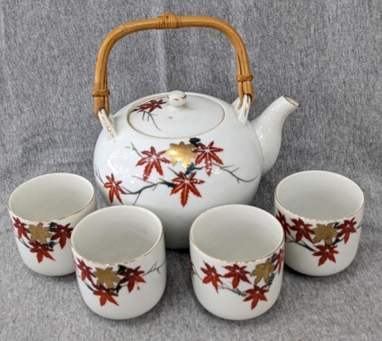 Cute little Japanese teapot with 4 matching cups; teapot measures 5-1/2" tall.