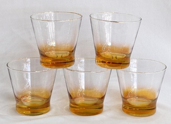 Set of 5 drinking glasses with a pretty pearlized amber color on the base of the glasses; each