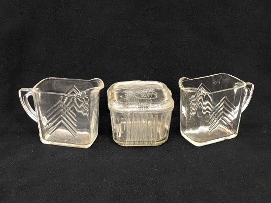 4-1/2" wide refrigerator dish with vegetable lid, plus two arrow pattern creamers that look like