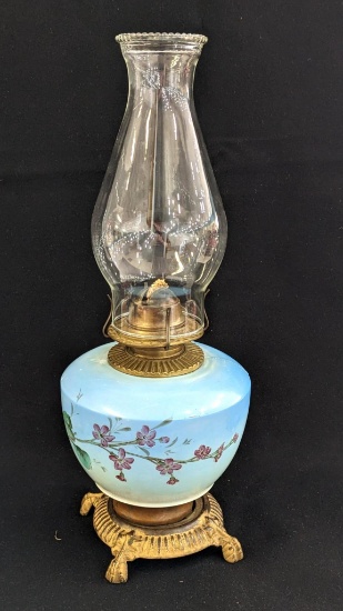 Pretty parlor oil lamp is 17" over chimney and has Eagle burner. For decoration only, notable chips