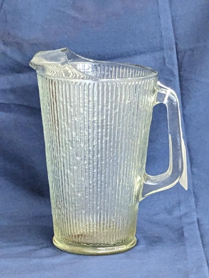 Classic pitcher stands 9" tall and is in good condition. Bottom marked 4A.