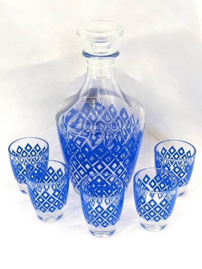 Eye-catching decanter and 5 shot glasses. Was made in France. Decanter stands approx 7" tall. Shot