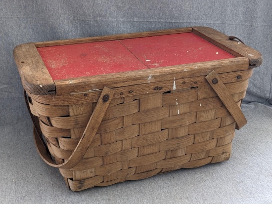 Vintage picnic basket. Has a sliding top and measures about 19" x 10" x 10" Both leather straps