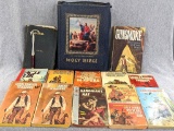 Louis L'Amour and other western books, vintage Bible that once belonged to Martha Kisow, and another