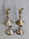 Two sets of silver plated candle holders; taller set measures 6-1/4