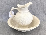 McCoy wash basin and pitcher. Small chip noted on bottom of basin, but both pieces in otherwise good
