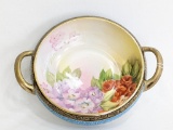A beautiful Nippon two-handle bowl w/ a beautiful floral print on the inside. Measures 9