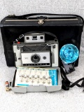 Awesome Vintage Polaroid 320 Land Camera complete with flash, package of replacement bulbs, papers,