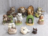 Owl figurines of a bunch of wise guys and gals. Delicate pair of owls on the stump is a small