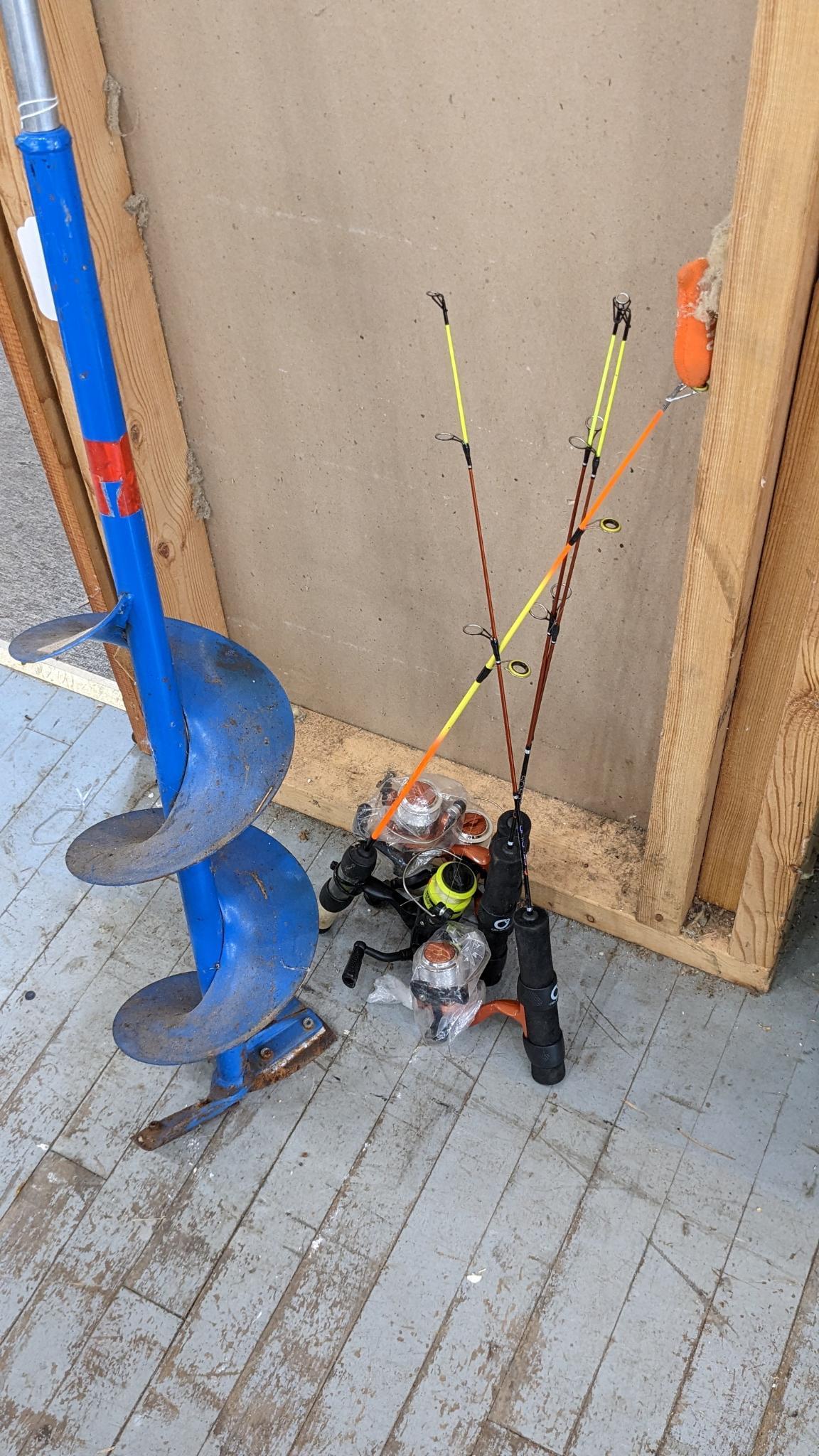 Four ice fishing poles and a 7 ice auger ready