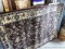 Brown toned 4' x 6' area rug and another similar rug. Matches Lot 940.