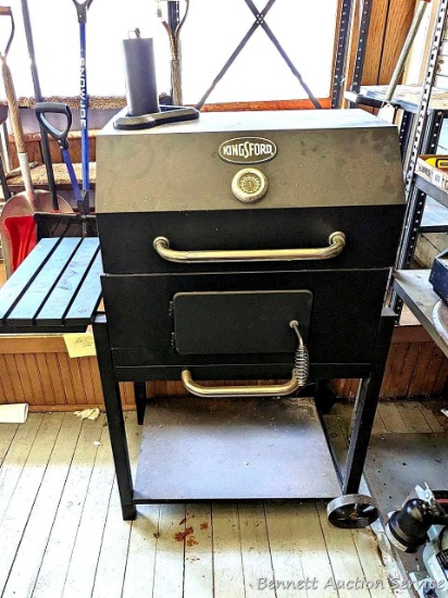 Kingsford charcoal grill has a 16" x 24" cook surface and looks like it's in very good condition.