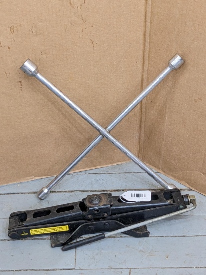 Automotive scissor jack and a four way lug wrench.
