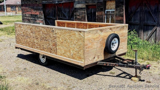 14-1/2' long custom wooden trailer on a heavy duty steel frame. Trailer has stabilizer jacks,