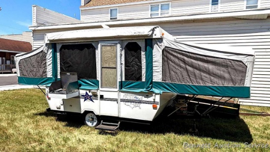 Starcraft Northwest Campers popup camper. Camper appears to be in good condition with stabilizer