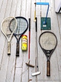 Spalding tennis racket plus two others, tennis balls, golf putters, practice golf set up.