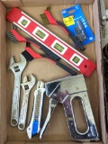 Stanley stapler, wire brushes, wrenches, a level, and more.