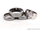 Four men's rings. Two are marked 'Forgiven' on inside of band, along with 'True Love'. Cross ring