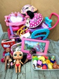 Two toy shopping carts; Minnie Mouse bicycle helmet; play food; dolls, more. 7-1/2