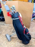 Allied golf club set in a nice bag that's on a collapsible golf club cart. The clubs are in pretty