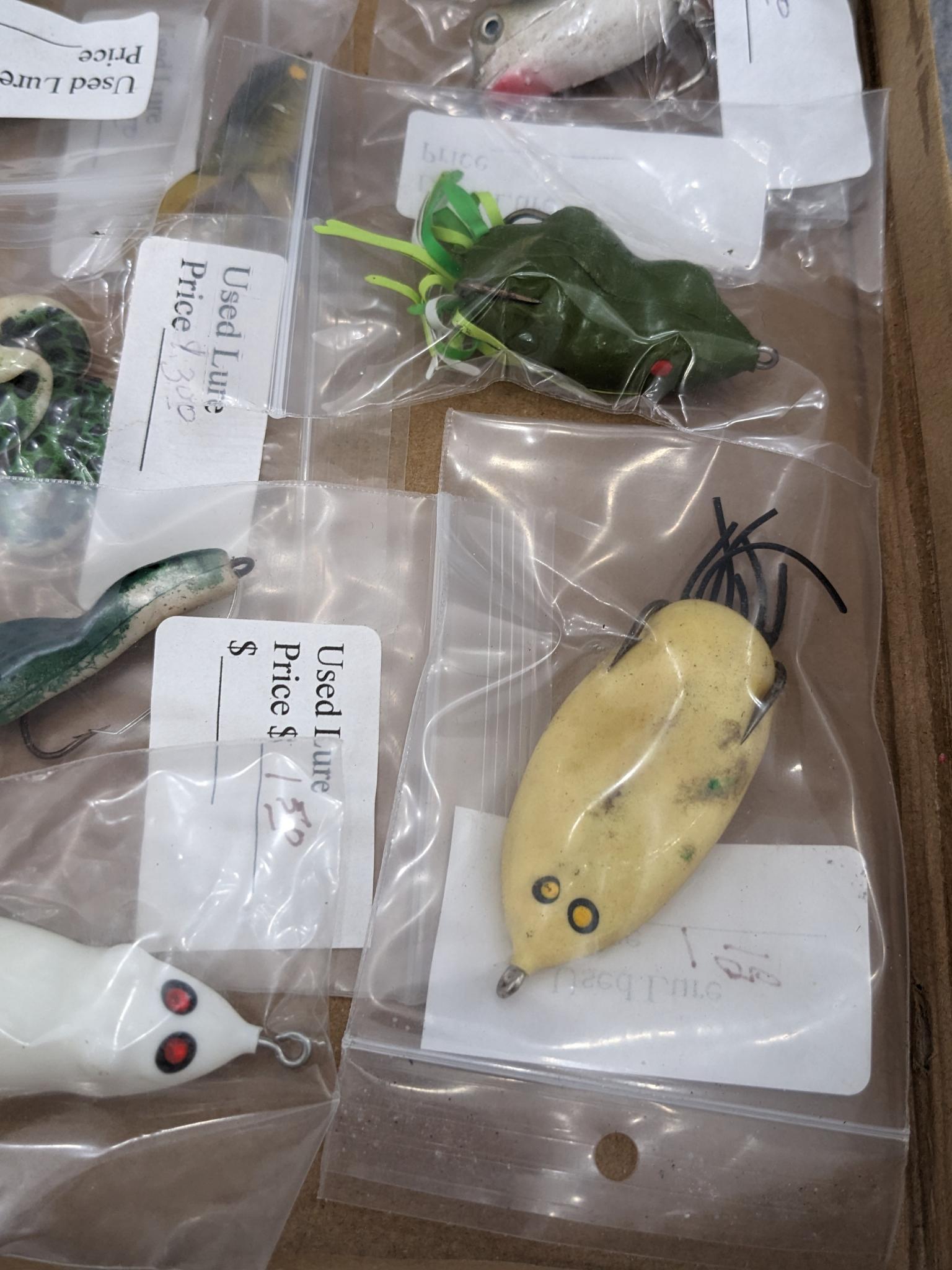 Vintage and newer mouse and frog fishing lures.