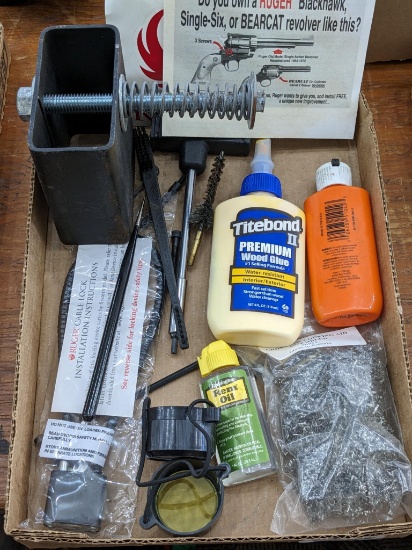 Will ship without liquids. Rem Oil, Hoppe's No. 9, Ruger handgun literature, gun lock, steel fixture