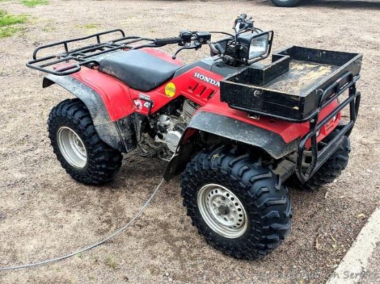 Honda Fourtrax Foreman 4x4 ATV has a Honda 350 cc engine. Starts and runs with a splash of gas on