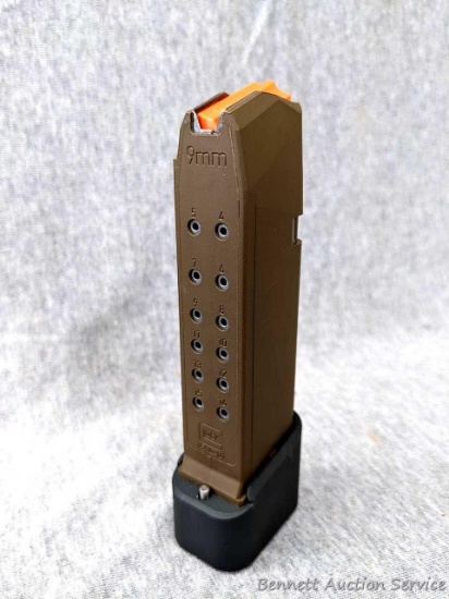 New looking 9mm Glock magazine with a 15 round capacity and an aftermarket aluminum TTI extension