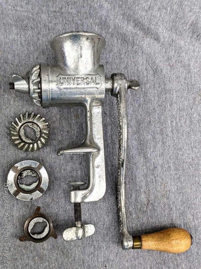 Universal No. 1 meat grinder or food chopper comes with some attachments. Measures about 10-1/2"