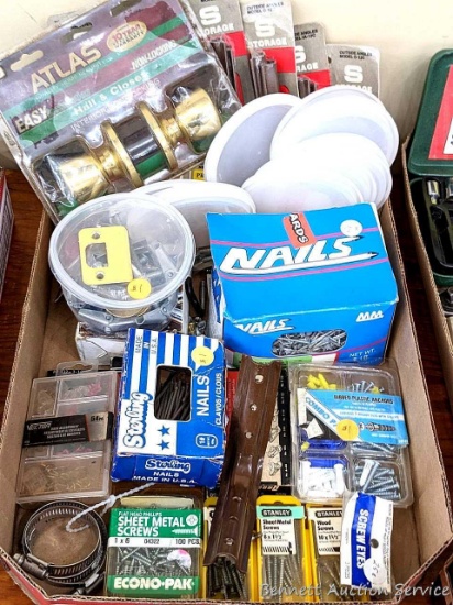 Atlas door knob, box of MM galvanized 1-1/2" nails, NIP storage angles, screws, Arrow staples, hose