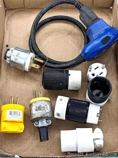 Reliance AmWatt load tester and a couple of outlet plug cord ends.
