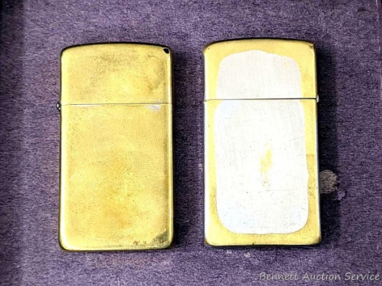 Two Zippo lighters are both about 2-1/4" tall. Neither sparks, may be easy to get back into