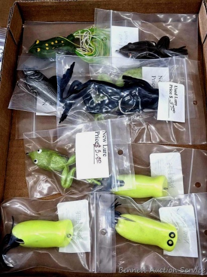 Several frog fishing lures and a minnow. Older looking one about 4"