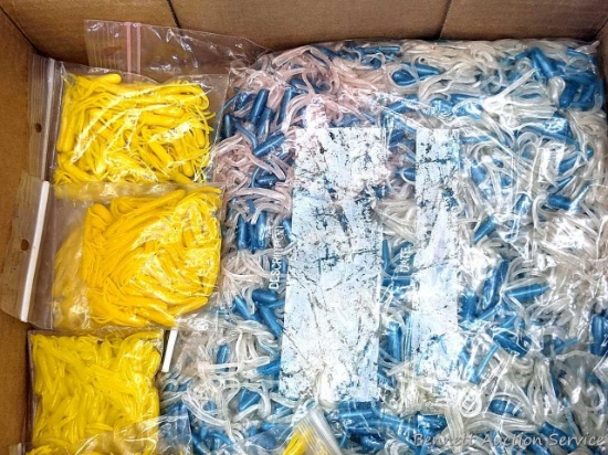 18" x 12" flat of soft plastic lures in bags.