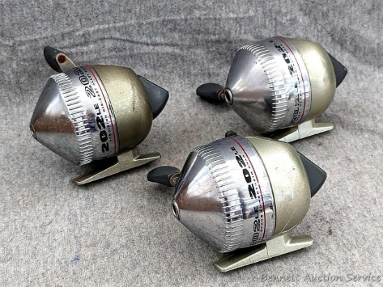 3 Zebco 202LE fishing reels. 2 handles spin, one does not spin as smoothly. All about 3-3/4" tall