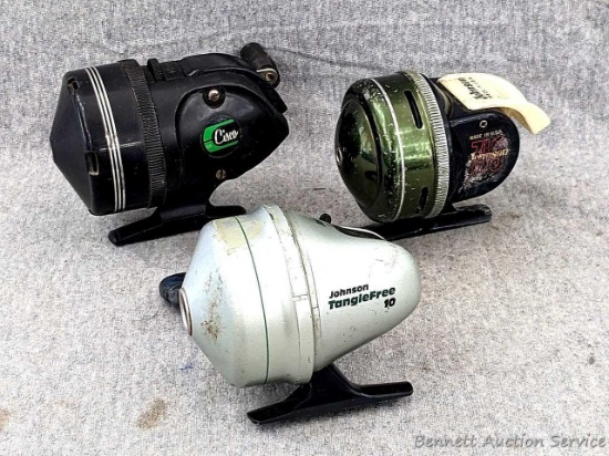 Vintage Johnson fishing reel plus another Johnson reel and a Cisco reel. All handles turn smoothly.