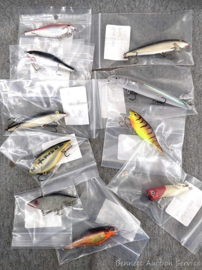 10 hard fishing lures incl Rapala and other, some rattle. Longest about 5" over body and tongue.