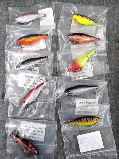 10 hard fishing lures, some or all rattle. Longer about 3-3/4" over body and tongue.