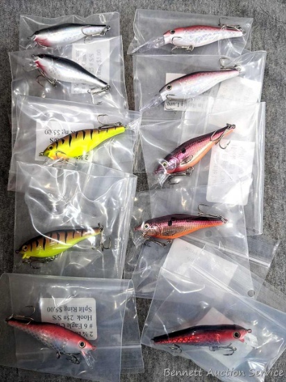 14 hard fishing lures, some or all rattle. Longer about 3-3/4" over body and tongue.