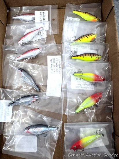 12 hard fishing lures, some or all rattle. Longer about 3-3/4" over body and tongue.