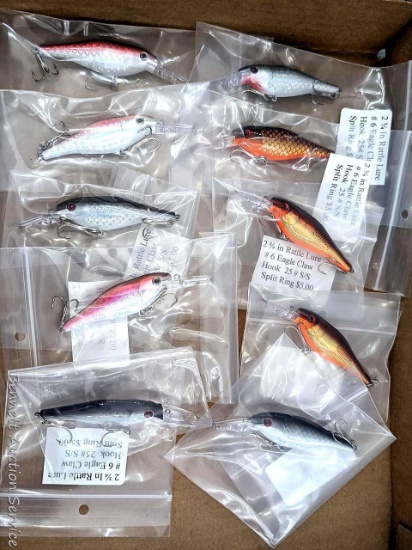 10 hard fishing lures, most or all rattle. All about 4" long.